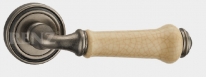 Ручка дверная на круглой розетке RENZ  Сиракузы INDH 617-16 SL/CC Серебро античное/керам.Кофе