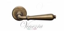 Ручка дверная на круглой розетке Venezia Classic D1 Бронза матовая