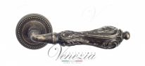 Ручка дверная на круглой розетке Venezia Monte Cristo D3 Бронза античная