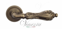 Ручка дверная на круглой розетке Venezia Monte Cristo D3 Бронза матовая