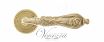 Ручка дверная на круглой розетке Venezia Monte Cristo D3 Латунь блестящая