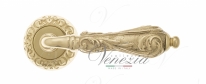 Ручка дверная на круглой розетке Venezia Monte Cristo D4 Латунь блестящая