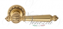 Ручка дверная на круглой розетке Venezia Pellestrina D2 Золото французское + коричневый