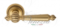 Ручка дверная на круглой розетке Venezia Pellestrina D3 Золото французское + коричневый