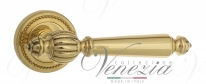 Ручка дверная на круглой розетке Venezia Pellestrina D3 Латунь блестящая