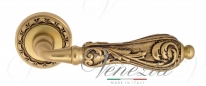 Ручка дверная на круглой розетке Venezia Monte Cristo D2 Золото французское + коричневый