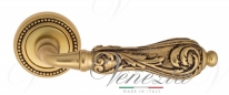 Ручка дверная на круглой розетке Venezia Monte Cristo D3 Золото французское + коричневый