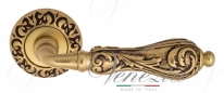 Ручка дверная на круглой розетке Venezia Monte Cristo D4 Золото французское + коричневый