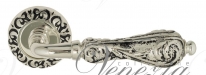 Ручка дверная на круглой розетке Venezia Monte Cristo D4 натуральное серебро + черный