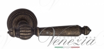 Ручка дверная на круглой розетке Venezia Pellestrina D3 Бронза античная
