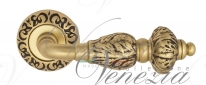 Ручка дверная на круглой розетке Venezia Lucrecia D4 Золото французское + коричневый