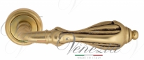 Ручка дверная на круглой розетке Venezia Anafesto D1 Золото французское + коричневый
