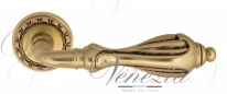 Ручка дверная на круглой розетке Venezia Anafesto D2 Золото французское + коричневый