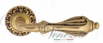 Ручка дверная на круглой розетке Venezia Anafesto D4 Золото французское + коричневый