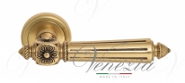 Ручка дверная на круглой розетке Venezia Castello D1 Золото французское + коричневый