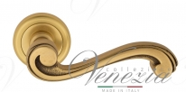 Ручка дверная на круглой розетке Venezia Vivaldi D1 Золото французское + коричневый