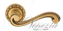Ручка дверная на круглой розетке Venezia Vivaldi D2 Золото французское + коричневый