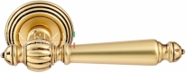 Ручка дверная на круглой розетке Extreza DANIEL (Даниел) 308  R05 Золото французское + коричневый F59