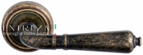 Ручка дверная на круглой розетке Extreza PETRA (Петра) 304  R01 Бронза античная F23