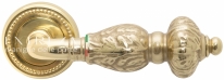 Ручка дверная на круглой розетке Extreza TESLA (Тесла) 315  R03 полированное золото F01