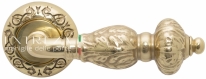 Ручка дверная на круглой розетке Extreza TESLA (Тесла) 315  R04 полированное золото F01