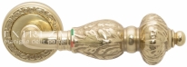 Ручка дверная на круглой розетке Extreza TESLA (Тесла) 315  R06 полированное золото F01