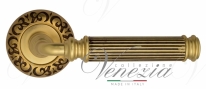 Ручка дверная на круглой розетке Venezia Mosca D4 Золото французское + коричневый