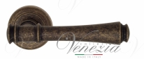 Ручка дверная на круглой розетке Venezia Callisto D1 Бронза античная