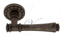 Ручка дверная на круглой розетке Venezia Callisto D2 Бронза античная