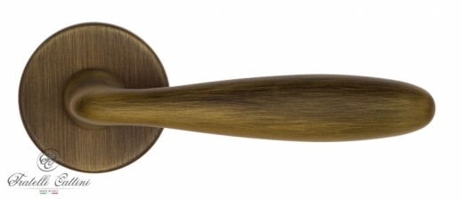 Ручка дверная на круглой розетке Fratelli Cattini 