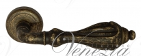 Ручка дверная на круглой розетке Venezia Anafesto D1 Бронза античная