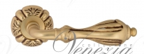 Ручка дверная на круглой розетке Venezia Anafesto D5 Золото французское + коричневый