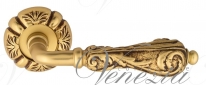 Ручка дверная на круглой розетке Venezia Monte Cristo D5 Золото французское + коричневый