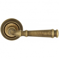 Ручка дверная на круглой розетке Extreza BONO (Боно) 328 на розетке R05 матовая бронза F03