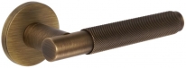 Дверная ручка Extreza Hi-tech Slim TUBA 126 на круглой розетке R16 матовая бронза F03