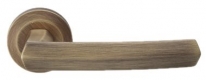 Дверная ручка LINEA CALI на круглой розетке "DAFNI" 509 RO 102 PM патина матовая